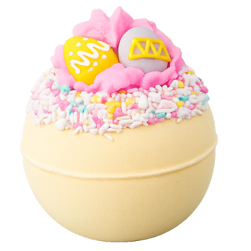 Decorative bath bomb with pink top and colorful sprinkles on a white background