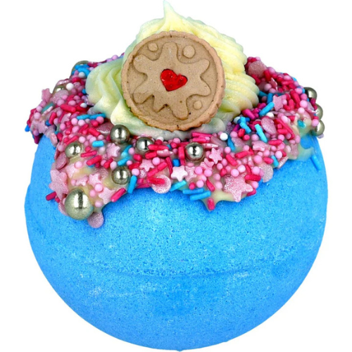 Colorful bath bomb with a cookie and sprinkles on top against a white background